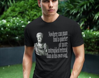 May include: A black t-shirt with a quote from the Roman philosopher, Marcus Aurelius, printed on the front. The quote reads: "Nowhere can man find a quieter or more untroubled retreat than in his own soul."
