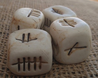 Handmade ceramic dice shaped ogham charms. Ancient language ceramic charms. Ogham charms. Ogham ceramic dice.