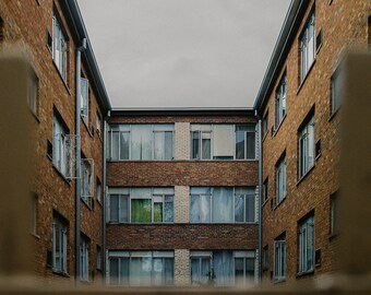 Symmetrical City Apartment Building with One Single Green Curtain on a Gloomy Day | Fine Art Print taken on 35mm Film in Chicago