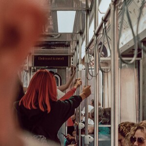 Wall Decor | Red Headed Train Passenger Arriving at a Stop on the El | Fine Art Photography Print taken on 35mm Film in Chicago Illinois