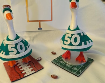 Desk Goose Clothing , Football outfit, hat and field option available. Also, two sizes available.