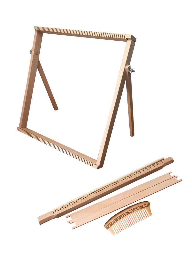 May include: A wooden loom with a stand, a comb, and a separate weaving bar. The loom is made of natural wood and has a simple design.