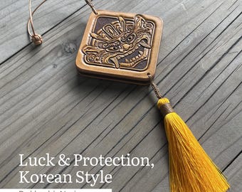 Hand-Carved Leather Dokkaebi Norigae: Yellow Korean Goblin Amulet