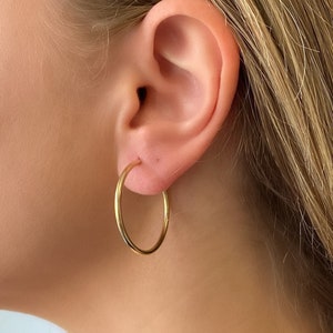 14k solid gold hoop earring. 1.25 inch genuine gold hoop earrings. 2mm gold hoops. Jewelry gift.