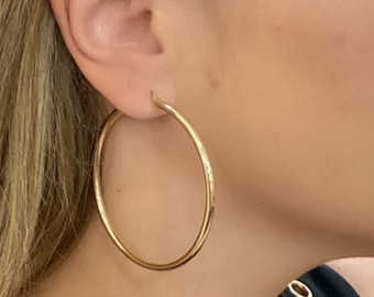 14k solid gold hoop earrings. 2.5 inch gold hoop earrings. Genuine Gold hoops.