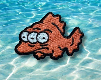 Parche termoadhesivo bordado de Blinky: Pez de tres ojos de Los Simpson.
