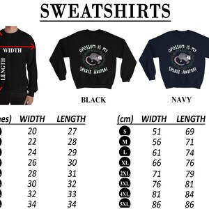 May include: Black and navy blue sweatshirts with the text "Opossum is my spirit animal" and a possum graphic. Size chart in inches and centimeters.
