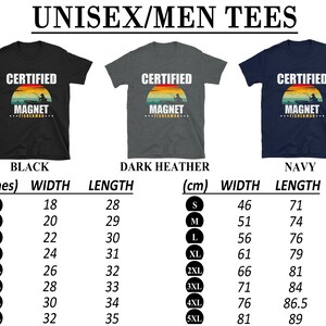 May include: A size chart for unisex t-shirts in black, dark heather, and navy blue. The shirts feature a vintage-style graphic with the text "Certified Magnet Fisherman". The chart shows measurements in inches and centimeters for width and length.