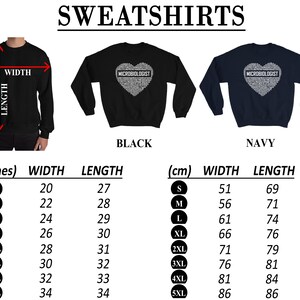 May include: Black and navy blue sweatshirts with a heart-shaped design featuring the word "MICROBIOLOGIST" in white text. The sweatshirts are available in sizes S-5XL. Size chart in inches and centimetres.