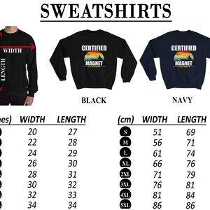 May include: A size chart for a black and navy blue sweatshirt with the text "Certified Magnet Fisherman" in a vintage style font. The chart shows measurements in inches and centimeters for sizes S through 5XL.