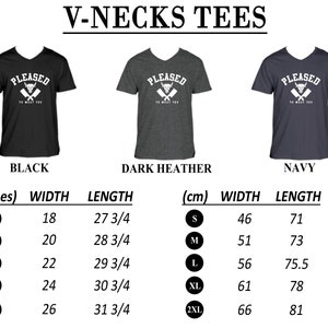 May include: V-neck t-shirt with the text "PLEASED TO MEAT YOU" and a bull's head graphic. Available in black, dark heather, and navy. Size chart in inches and centimeters.