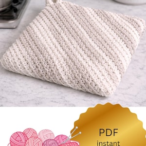 May include: A square, hand-crocheted potholder in shades of cream and light gray, with a loop for hanging. The diagonal stitch pattern creates a textured surface. The image also includes a basket of yarn and the text "PDF instant download."