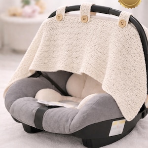 May include: A light-weight car seat cover in cream-colored knit fabric. The cover is secured with wooden buttons and drapes over a gray and black car seat. Text on the image reads "PEEK-A-BOO Light weight carseat cover" and "PDF/EASY".