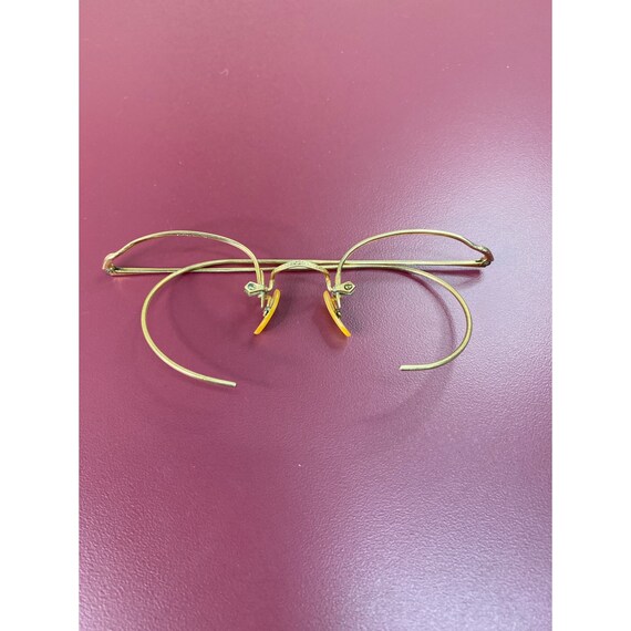 Lentes con borde dorado sale