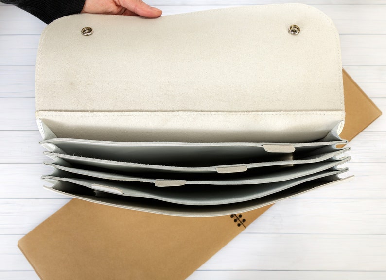 White leather accordian case for documents