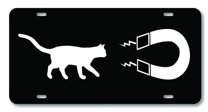 May include: A black and white image of a cat running away from a magnet. The magnet is white with a black outline and has a magnetic field represented by two white zig-zag lines.