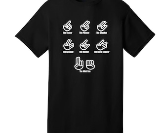 May include: Black t-shirt with a white graphic of different hand gestures and the text "The Teaser", "The Pleaser", "The Shocker", "The Spocker", "The Rocker", "The Show Stopper", and "The Mini Van".