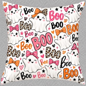 May include: A square throw pillow featuring a repeating pattern of white cartoon ghosts on a white background. The ghosts wear pink, orange, or leopard-print bows. The design includes the word Boo in various fonts and colors, plus small hearts and stars.
