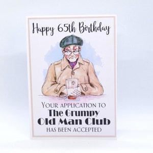 May include: A humorous birthday card featuring a cartoon illustration of an older man with a glass of beer. The card reads "Happy 65th Birthday. Your application to The Grumpy Old Man Club has been accepted."