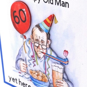 May include: A humorous birthday card featuring a cartoon illustration of a man wearing a party hat and holding a beer. The card has the text "I thought you would be a grumpy old man, yet here you are 60".