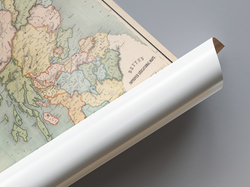 May include: An antique map of Europe, with a white rolled edge. The map features detailed illustrations of countries and regions in various colors. The text "BETTS'S IMPROVED EDUCATIONAL MAPS" is visible. The map is partially rolled.