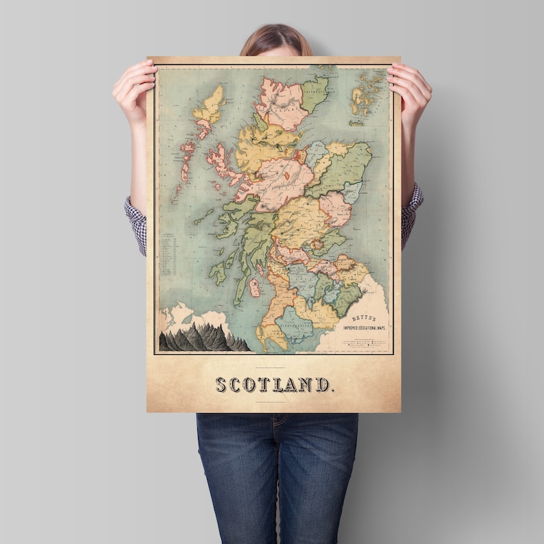 May include: A vintage map of Scotland, featuring a detailed depiction of the country's regions in shades of green, yellow, pink, and blue. The map is framed with a beige border and includes the word "SCOTLAND" at the bottom.