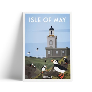 May include: A framed art print depicting the Isle of May, Scotland, with a lighthouse and puffins. The print has a light blue sky background with the text "Isle of May" at the top. The word "Scotland" is at the bottom.