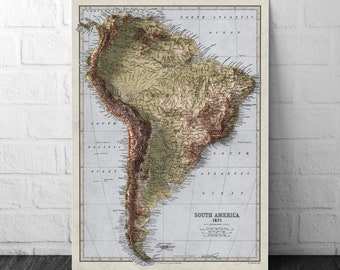 May include: A vintage map of South America from 1871, showing the continent's topography with brown and green hues. The map is printed on a light blue background with detailed coastlines and rivers.