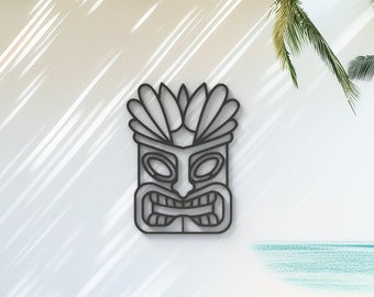 May include: Black metal tiki mask wall decor with a carved design. The mask has a large, open mouth with sharp teeth and a raised nose. The eyes are small and round.