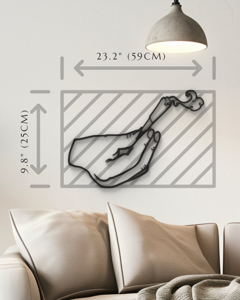 May include: Black metal wall art sculpture of a hand holding a lit cigarette with smoke rising. The sculpture is 23.2 inches wide and 9.8 inches tall.