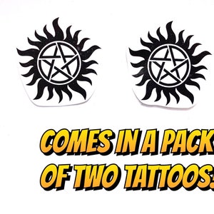 May include: Two black and white temporary tattoos of a pentagram inside a circle with sun rays. The tattoos are on a white background. The text "COMES IN A PACK OF TWO TATTOOS!" is below the tattoos.