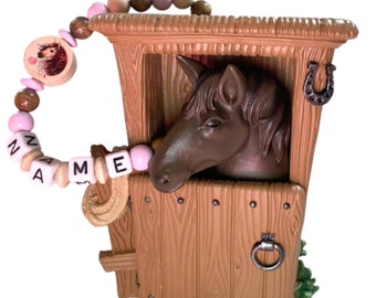 Money box horse in the stable with name, money box, piggy bank, brown horse