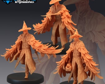 May include: Three miniature figures of plague doctors wearing long, feathered cloaks and conical hats. The figures are painted in a light brown color and are standing on black bases.