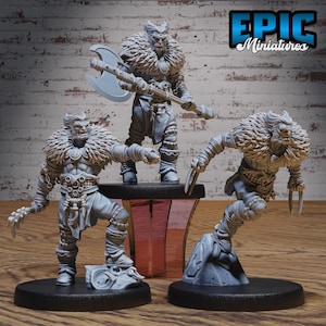 May include: Three gray painted miniature figures of fantasy creatures with fur and weapons. The figures are standing on round bases. The figures are from Epic Miniatures.