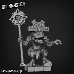May include: A grayscale 3D-printed figurine of a lizard-like creature, wearing a headdress and armour, and holding a staff with a starburst design. The figurine is standing on a stone base. The text "GOONMASTER" and "PRE-SUPPORTED" are visible.