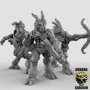 May include: Three grey, detailed, miniature figures of humanoid creatures with insect-like features, holding bows and arrows. The figures are posed in a dynamic action stance.
