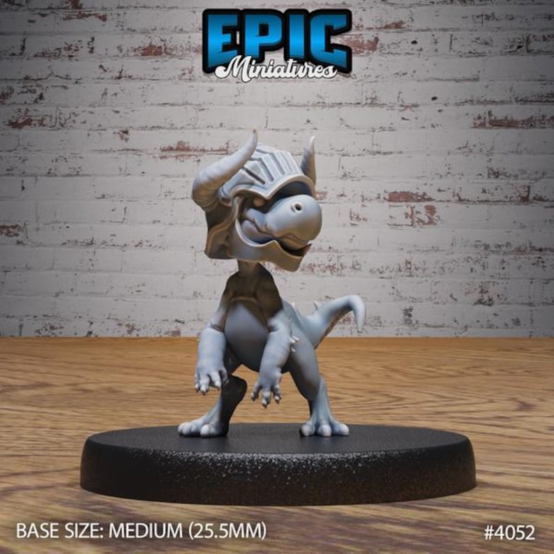 May include: A gray miniature figure of a dragon-like creature wearing a helmet, standing on a black base. The figure has horns and a tail. The base size is medium (1 inch). The logo "Epic Miniatures" is at the top.