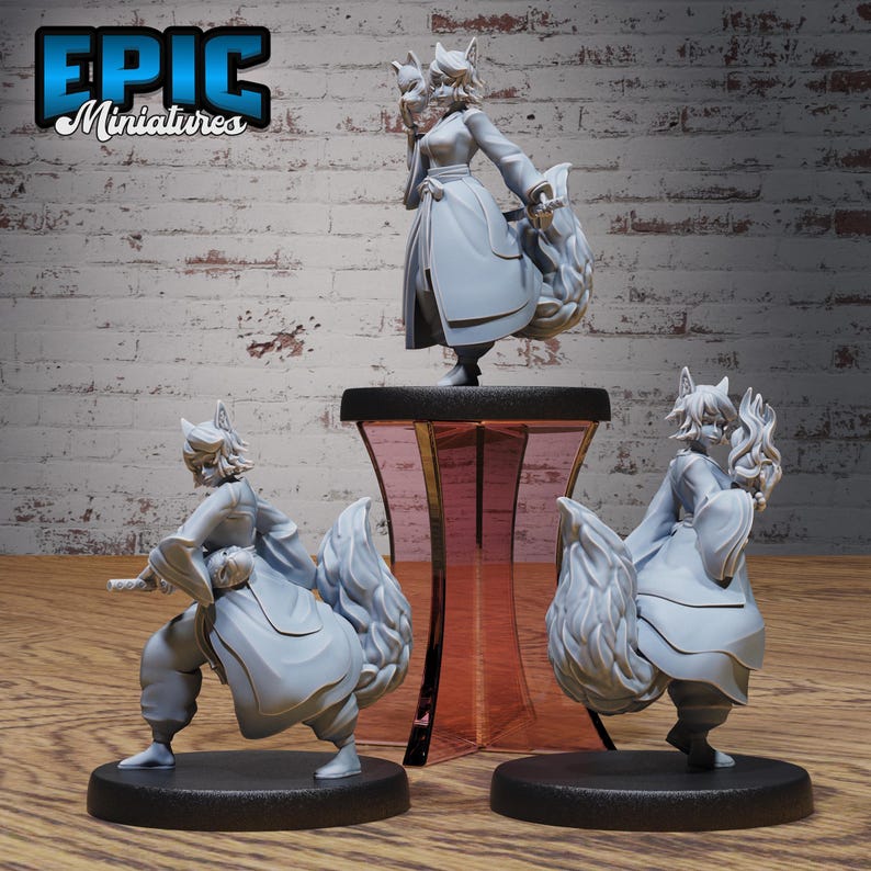 May include: Three gray painted figurines of fox-like creatures with bushy tails. The figures are posed in different stances and are standing on black bases. The figure in the center is on a pink and gold pedestal.