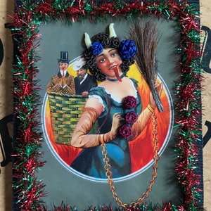 Reproduction Victorian “Lady Krampus” print decorated with Victorian inspired human hair work.