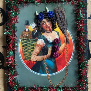 Reproduction Victorian “Lady Krampus” print decorated with Victorian inspired human hair work.