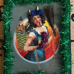 Reproduction Victorian “Lady Krampus” print decorated with Victorian inspired human hair work.
