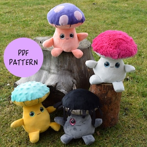 May include: Four plush mushroom toys with different colored caps and faces. The mushrooms are sitting on a tree stump and a green grassy surface. The text "PDF PATTERN" is on a purple circle.