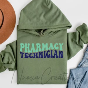 May include: A green hooded sweatshirt with the text "Pharmacy Technician" in a retro font with blue and green lettering.