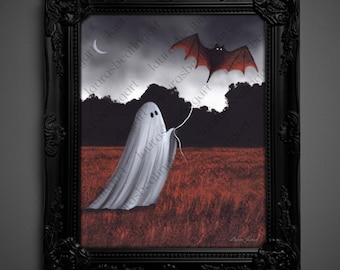 May include: A framed painting depicts a whimsical Halloween scene. A white ghost floats in a red field, holding a string that leads to a red bat in the cloudy sky. A crescent moon and dark trees complete the spooky artwork.