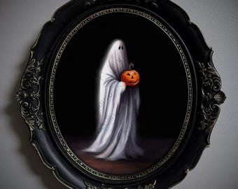 May include: An oval wall art piece featuring a white ghost draped in a sheet, holding a small orange jack-o'-lantern. The artwork is encased in an ornate, black, scalloped frame with intricate embossed detailing along the edges and corners.
