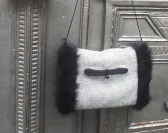 Gray reversible faux fur handmuff with interior pocket