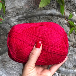 May include: A ball of bright pink yarn.