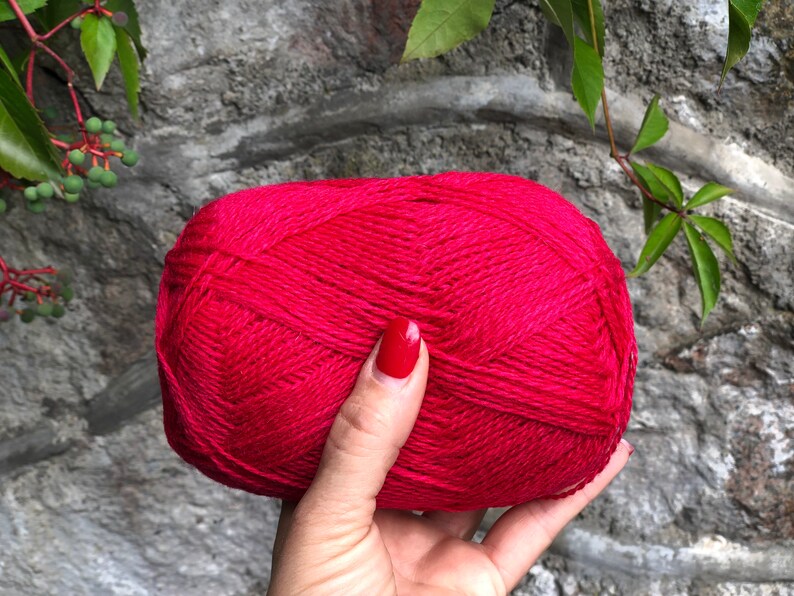 May include: A ball of bright pink yarn.
