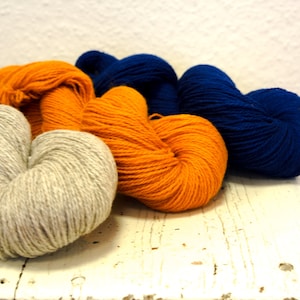 Warm grey, saffron yellow, ink blue 300g./10,5oz. New Zealand wool yarn for knitting outerwear, blankets, throws, woven coats, tufting rugs