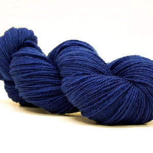 May include: A skein of deep blue yarn, wound into a heart shape.